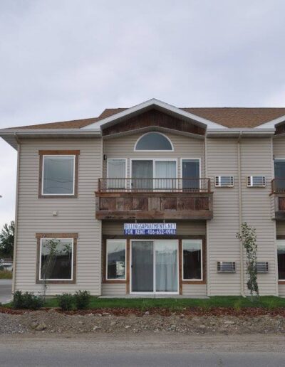 A two story apartment building with balconies and balconies.