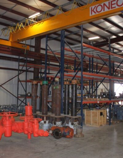 A large warehouse with a lot of pipes and equipment.